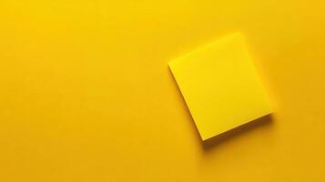 Bright yellow sticky note on vibrant background for notes and reminders photo