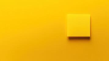 Bright yellow sticky note on vibrant yellow background highlights simplicity and creativity in design photo
