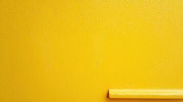 Bright yellow wall with a simple yellow ledge enhancing the vibrant color of a modern aesthetic space photo