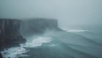 a view of cliff and water overlooking the ocean in the foggy fog photo
