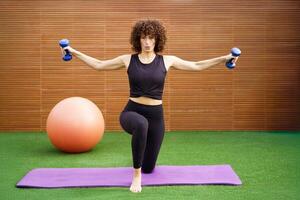 A Dynamic Workout Routine Focusing on Strength Training Using Dumbbells for Fitness Goals photo