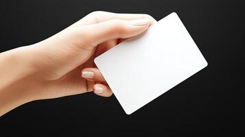 A delicate hand grips a blank card, inviting imagination and possibilities in a minimalist setting photo