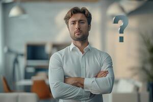 Man with question mark in office photo