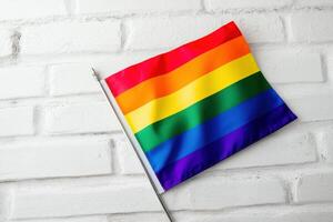 Colorful representation of LGBTQ pride flag on a white background during pride month celebration photo