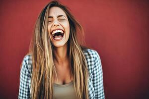 Portrait of a laughing drag queen in a gender fluid expression against a vibrant red background photo