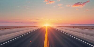 Long Open Highway Stretching Into the Horizon at Sunset photo