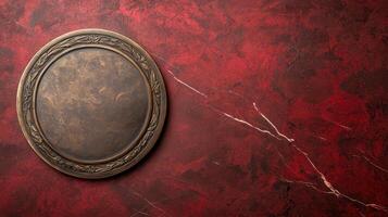 Blank bronze award plaque on a red marble background photo