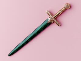 Green and gold ornate dagger on pink background photo