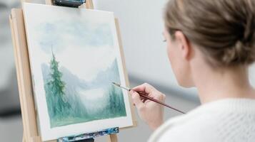 Realistic Painting of Woman Creating Scenic Landscape with Cerebral Palsy Art Style Featuring Mountains and Trees on Canvas photo