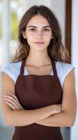 Portrait of Young Coffee Shop Owner Wearing Brown Apron in Bright Indoor Setting for Modern Business Concept photo