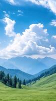 Majestic Clouds Over Breathtaking Mountain Range with Lush Green Valley and Tall Pines Under Stunning Blue Sky on a Clear Day Ideal for Nature Lovers and Scenic Landscape Enthusiasts photo