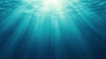 School of Dolphins Swimming Synchronously Beneath Ocean Surface in Tranquil Azure Waters with Sunlight Rays Creating Illumination Effects, Depicting Marine Life Harmony and Graceful Movement photo