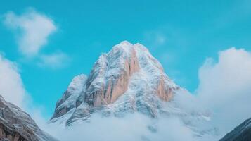 Snow Capped Mountains Under Starry Night Sky with Misty Clouds Highlighting Majestic Peaks in Winter Landscape photo