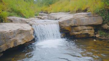 Tranquil Autumn Waterfall Flowing Over Rocks in Forest Setting Capturing Serenity and Natural Beauty in Extended Lush Landscape photo