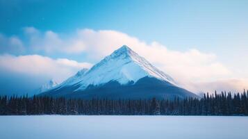 Snow Capped Mountain Under Starry Night Sky with Forest Silhouette Showcasing Winter Serenity and Cosmic Beauty in Tranquil Landscape with Clear Skies and Majestic Peaks for Nature Enthusiasts photo