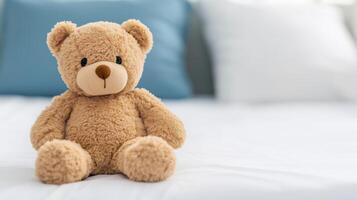 Cute Teddy Bear Sitting on Patient Bed in Hospital Room Setting, Symbolizing Comfort and Care, Soft Toy Scene with Blue and White Pillows, Ideal for Healthcare, Children and Recovery Concepts photo