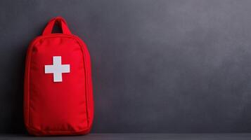 Emergency First Aid Kit on Plain Background for Medical and Educational Use, Red Backpack with White Cross, Isolated View, Suitable for Healthcare and Safety Concepts photo