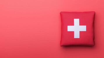 Red First Aid Kit on Pink Background for Emergency Medical Supplies and Healthcare Design with Copy Space photo