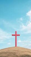 Red Cross on Hill Under Blue Sky Symbolizing Redemption and Faith, Christian Concept, Spiritual Landscape, Tranquil Scenery with Copy Space, Inspirational and Peaceful Atmosphere photo