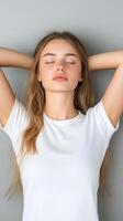 Woman Resting at Home with Hands Behind Head, Suffering from Neck Pain, Seeking Relaxation, Stress Relief, Comfortable Indoor Setting, Casual Wear, Peaceful Expression, Light-Filled Room photo