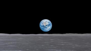 Earth Rising Above Moon Horizon in Space with Stunning Realistic Detail and Black Sky in Background Perfect for Astronomy Science Education photo