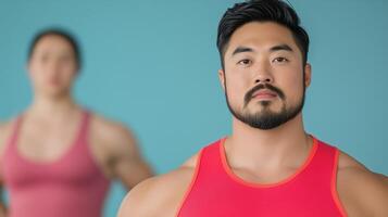 Plus Size Asian Male Model in Fitness Scene with Calm Expression and Soft Blue Background, Emphasizing Wellness and Body Positivity in Modern Stock Photography photo