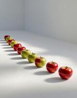 apples are lined up in a row on a white surfaceapples are lined up in a row on a white surface. photo