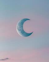 Crescent Moon Gleaming in a Twilight Sky photo