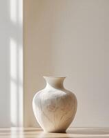 there is a vase with a floral design on it on a table photo