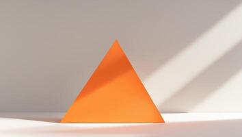 Abstract orange triangle with shadow and light play photo