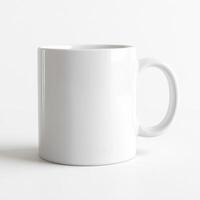 Blank white ceramic mug placed on a clean, light background showcasing its smooth design and potential for customization photo