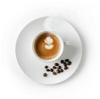 Freshly brewed coffee with latte art and coffee beans on a white plate photo