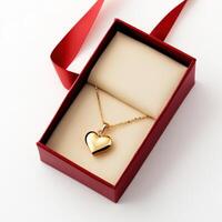 Heart-shaped gold pendant nestled in a red gift box with a satin ribbon for special occasions photo