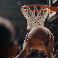 Player prepares to shoot basketball during a competitive game in an indoor arena filled with cheering fans photo