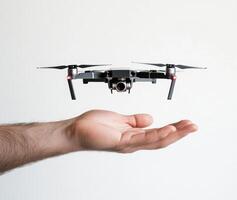 Hand holding a drone preparing for flight in a modern indoor space photo