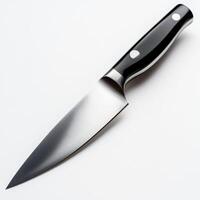 Sharp kitchen knife with a sleek black handle displayed on a light background for culinary use and food preparation photo