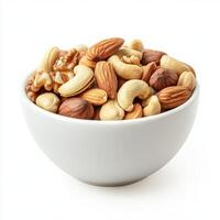 Variety of mixed nuts in a white bowl on a plain background for healthy snacking or culinary use photo