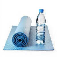 Fitness essentials for a yoga session at home with a blue mat and water bottle ready for use photo
