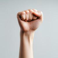 Raised fist symbolizes strength and solidarity in social movements photo