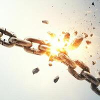 Chain breaking with a powerful explosion of sparks and debris in a dramatic display of force photo