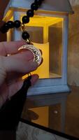 Muslim rosary with a crescent moon in the hands of a person, the approach of the Ramadan holiday video