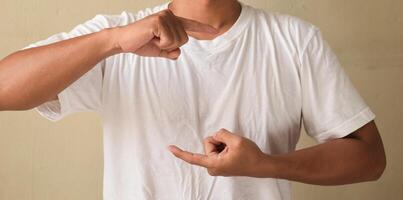 Young man make gesture hand about sign language to teaching to colleague photo