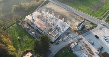 The process of building a modern hospital, footage of a hospital under construction, drone footage of a modern building under construction. video
