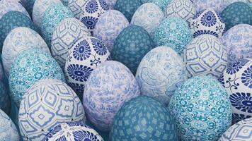 A collection of decorative Easter eggs with intricate blue and white floral and geometric patterns, arranged in a close-up view, showcasing their detailed designs video