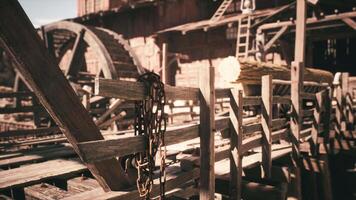 Detailed view of rustic lumber mill structure with logs and wooden pathways video