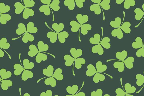 Seamless pattern of clover leaves for St. Patrick's Day. Clover leaves on green background. Suitable for wrapping paper, wallpaper, background, card and decoration.