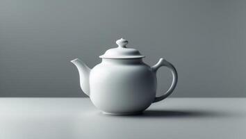 A white tea pot with a lid sits on a tableA white tea pot with a lid sits on a table. photo