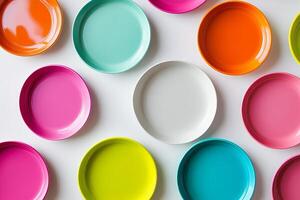 A row of colorful plates with one white plate in the middle photo