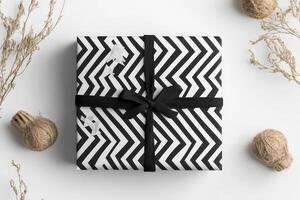 A black and white gift box with a black ribbon photo