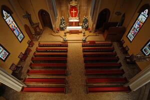 Aerial View of a Beautifully Decorated Church Interior with Stained Glass Windows photo